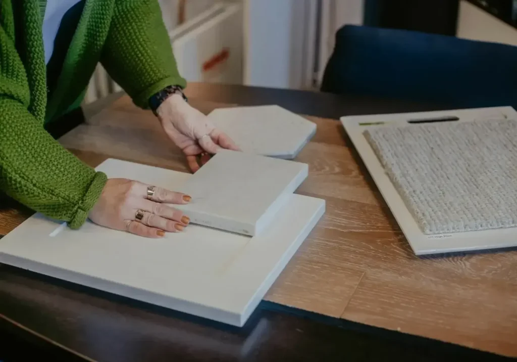 Design professional looking at tile samples